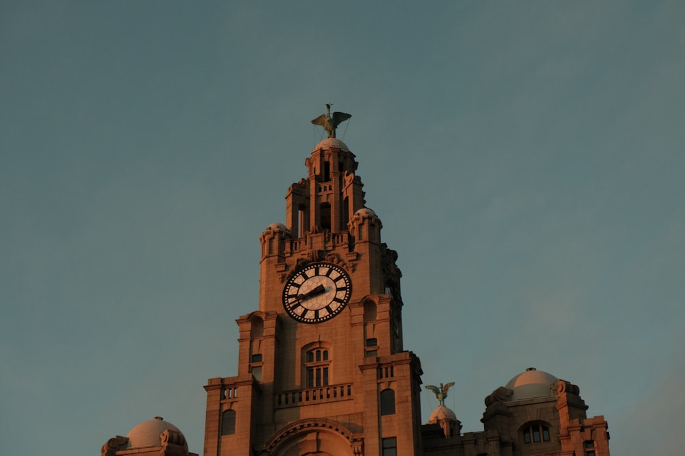 a large building with a clock on the top of it