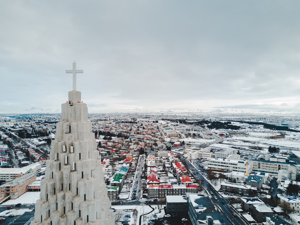 a very tall building with a cross on top of it