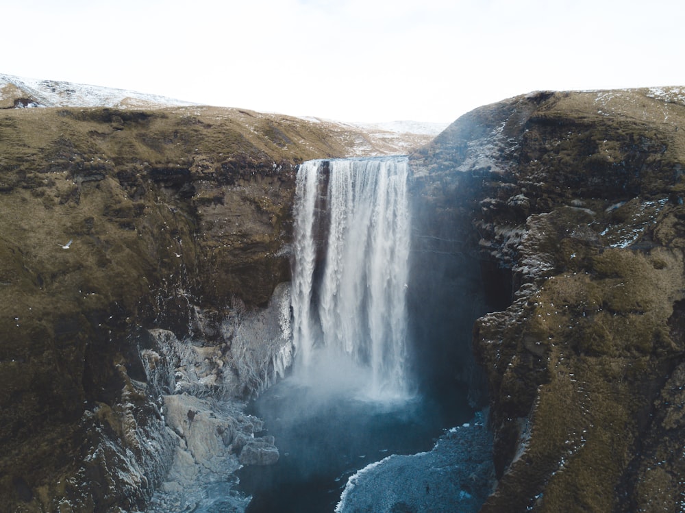 a waterfall with water coming out of it