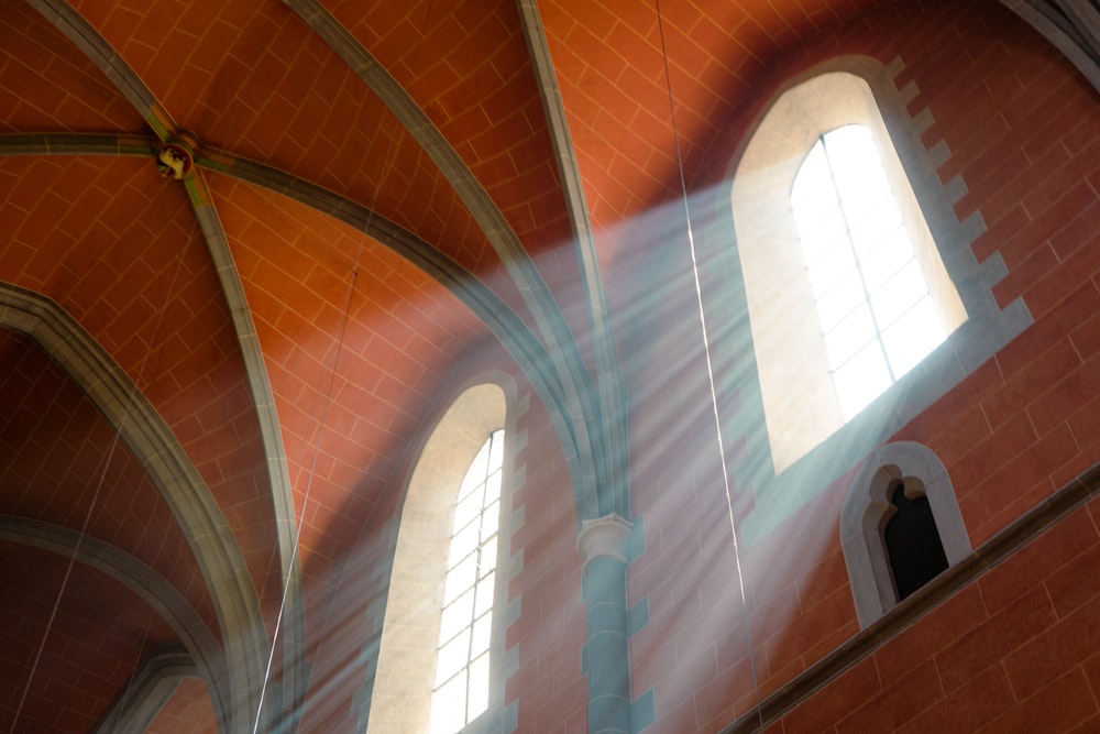 sunlight streaming through the windows of a church