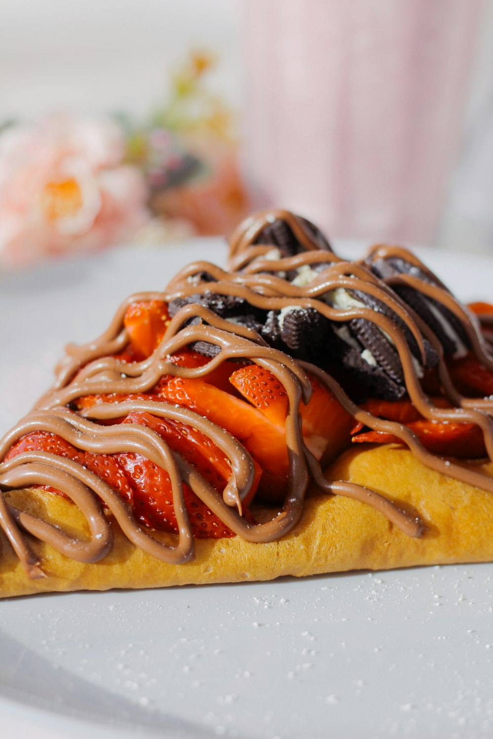 a slice of cake with chocolate and strawberries on it