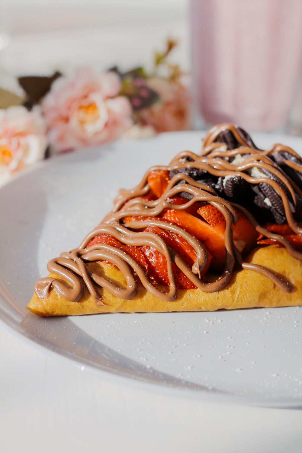 a slice of cake with chocolate and strawberries on it