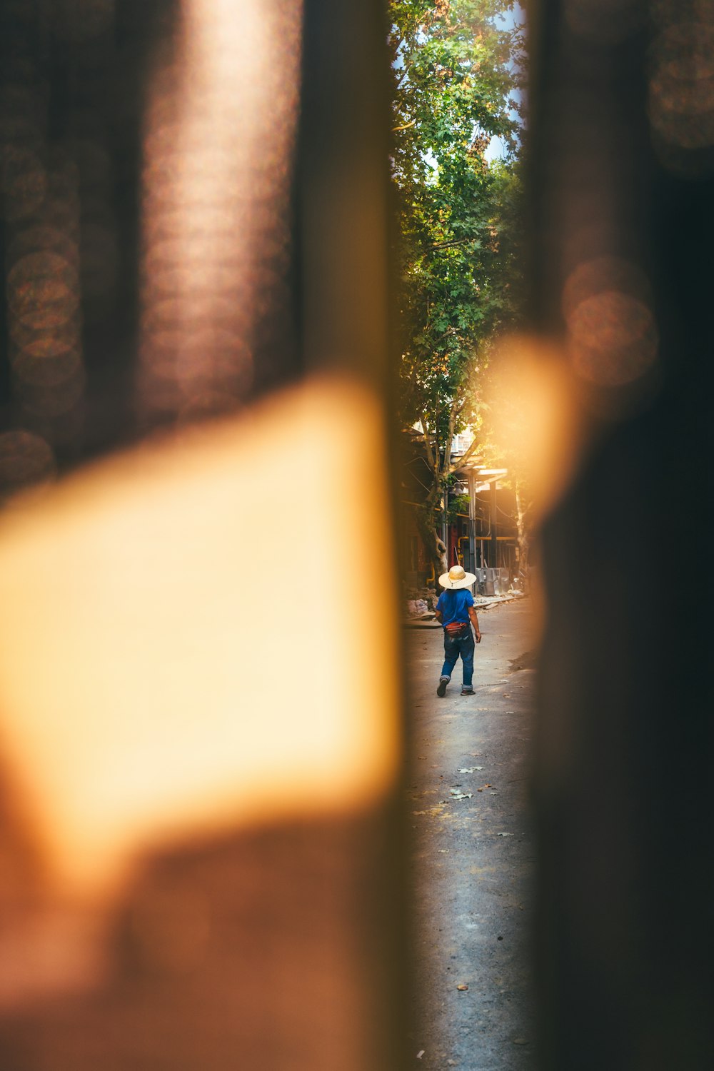 a blurry photo of a person walking down a street