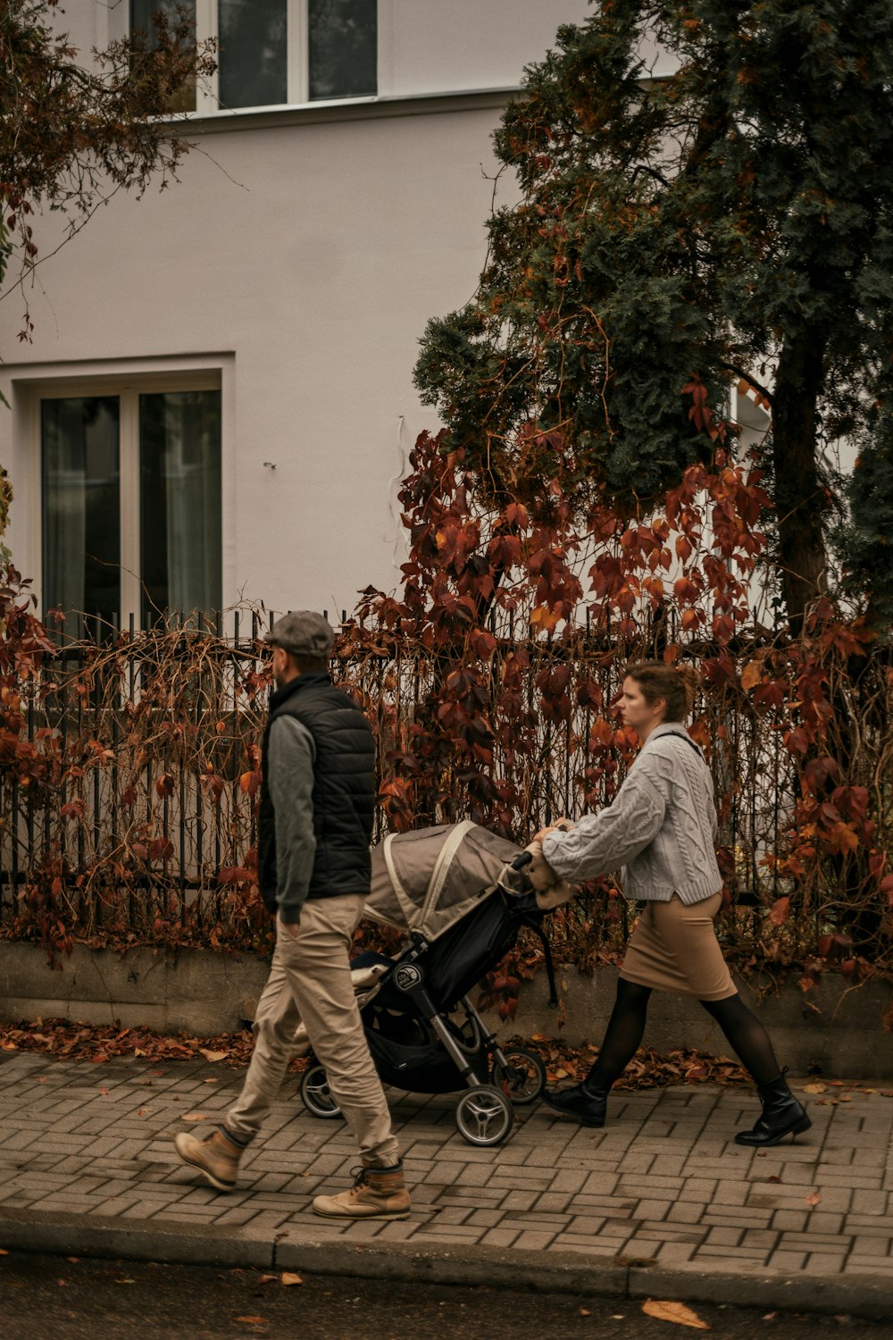 a man pushing a baby in a stroller