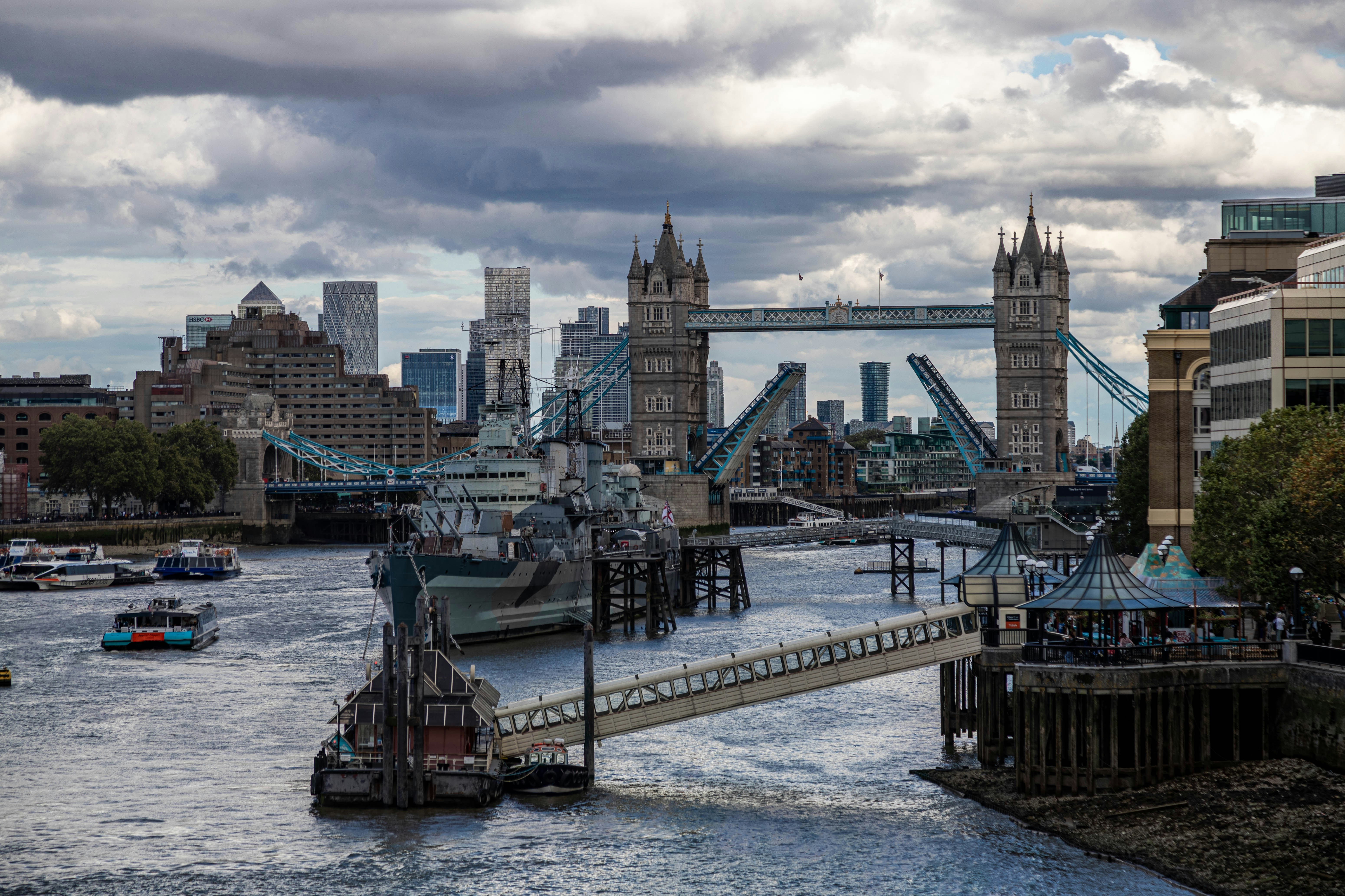 a view of a river with a bridge in the background