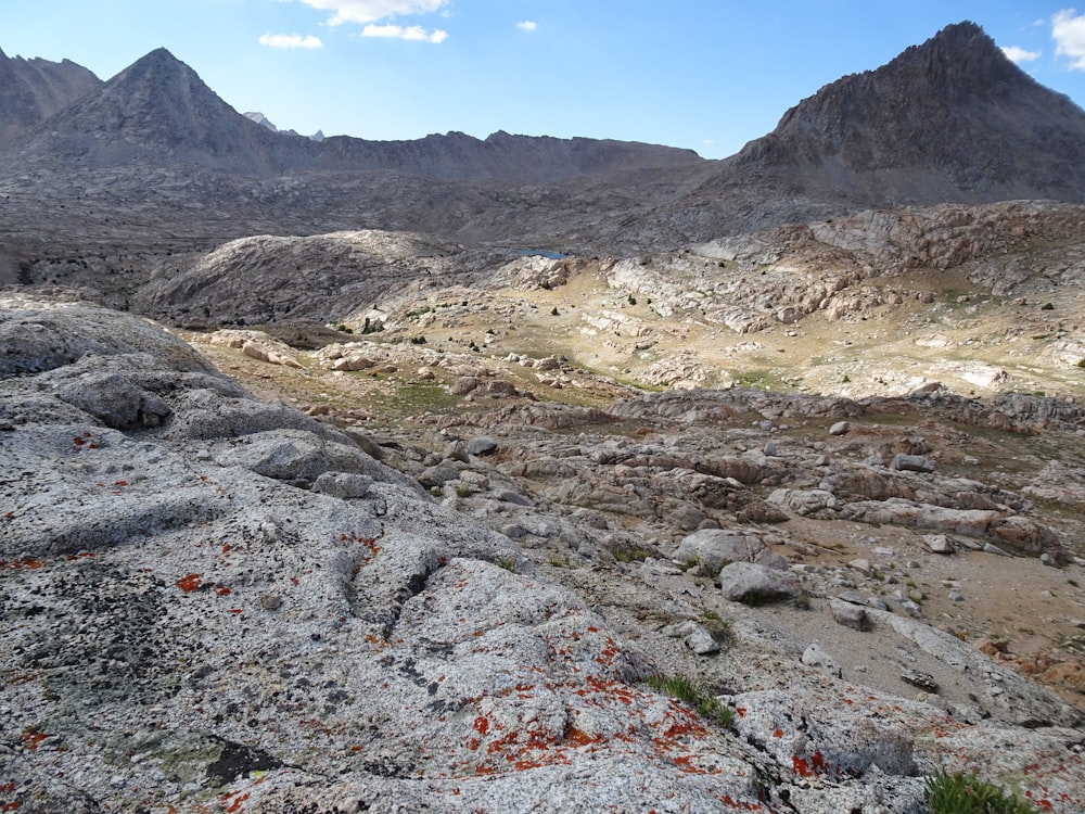 a view of a mountain range from a rocky outcropping