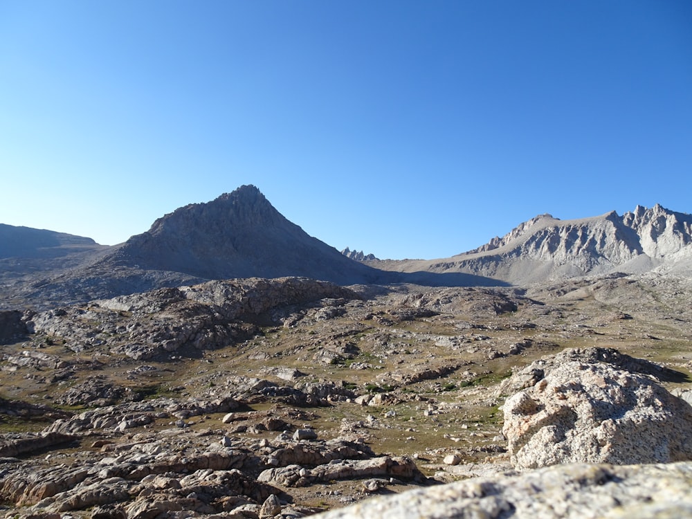 a view of a mountain range from a rocky outcropping