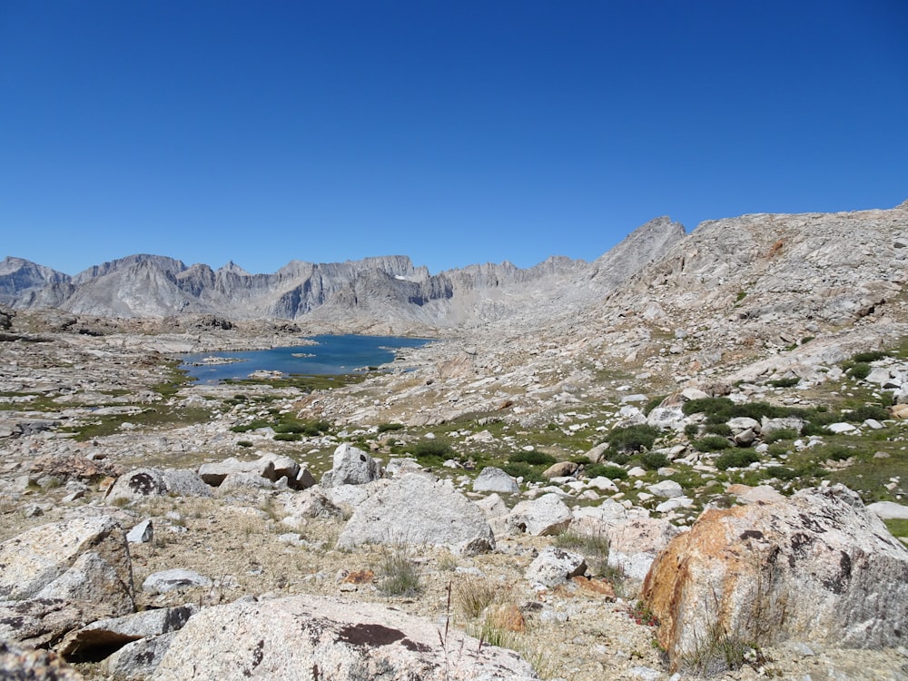 a view of a mountain lake from a rocky area