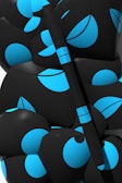 Abstract black and white geometric shapes arranged on a smooth surface.