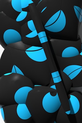 Abstract black and white geometric shapes arranged on a smooth surface.