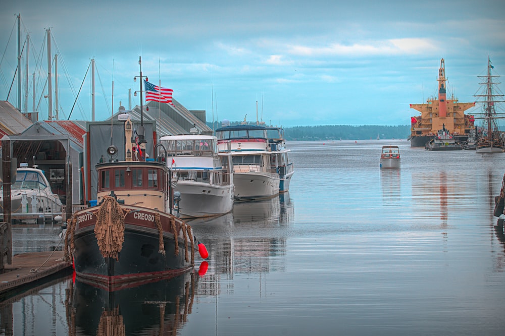 a group of boats that are sitting in the water