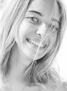 An intimate portrait of a person smiling.