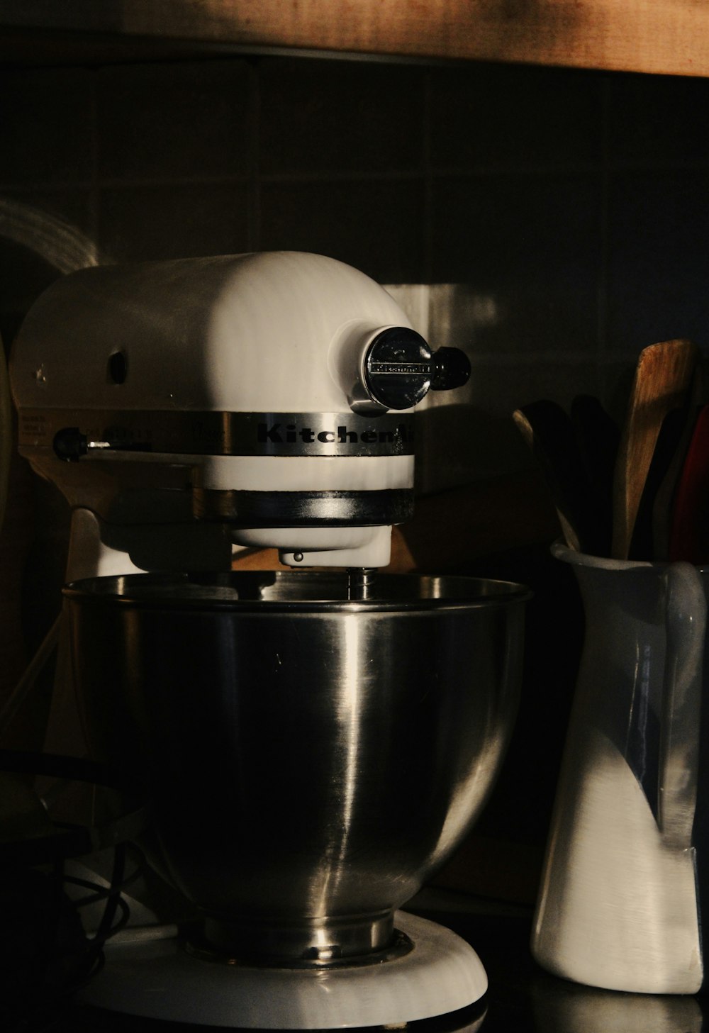 a silver mixer sitting on top of a counter