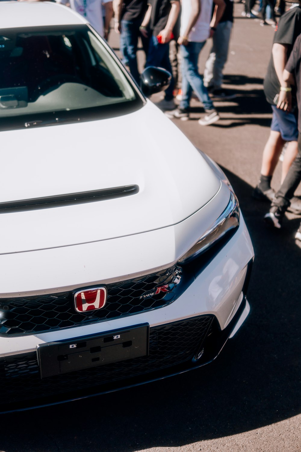 a white car parked on the side of a road