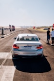 A BMW sports car on a racetrack.