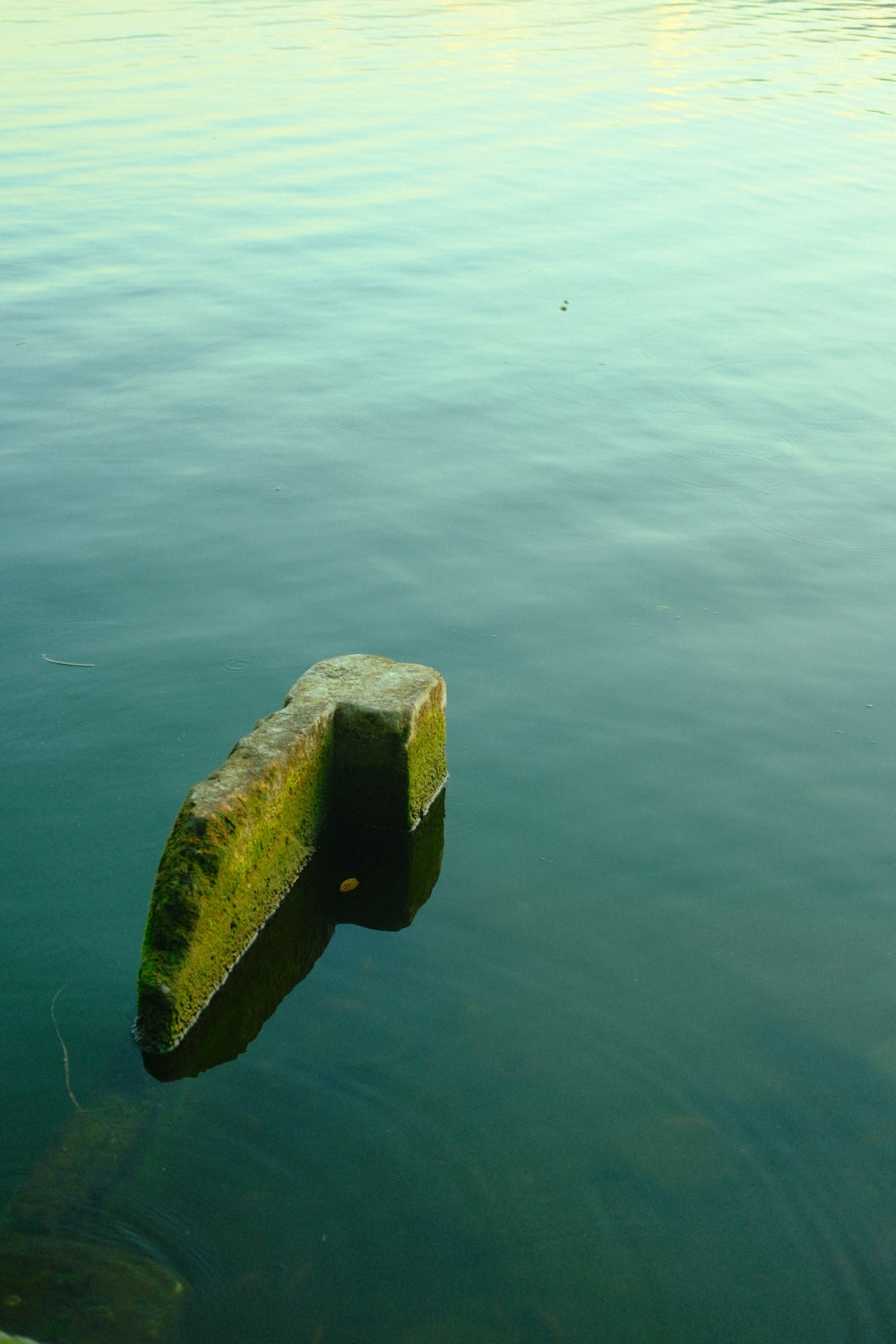 a concrete block floating on top of a body of water