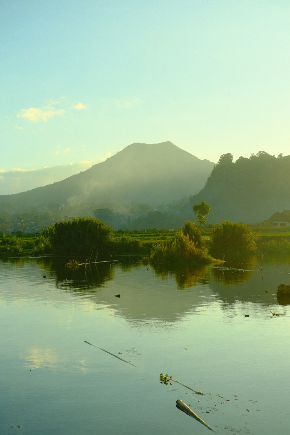 a body of water with mountains in the background