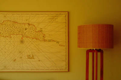 A vintage map spread open on a wooden table under soft light.