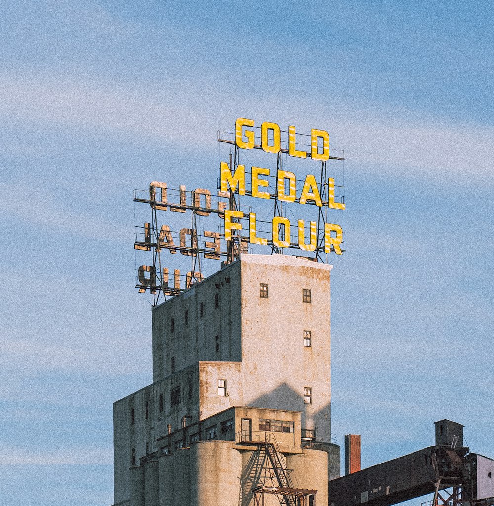 a large sign on top of a tall building