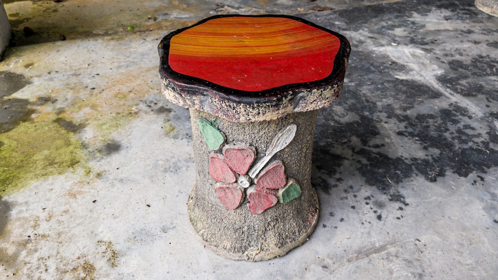 a stone with a flower painted on it