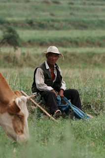 A candid moment of a local farmer sharing stories during a content shoot outdoors.