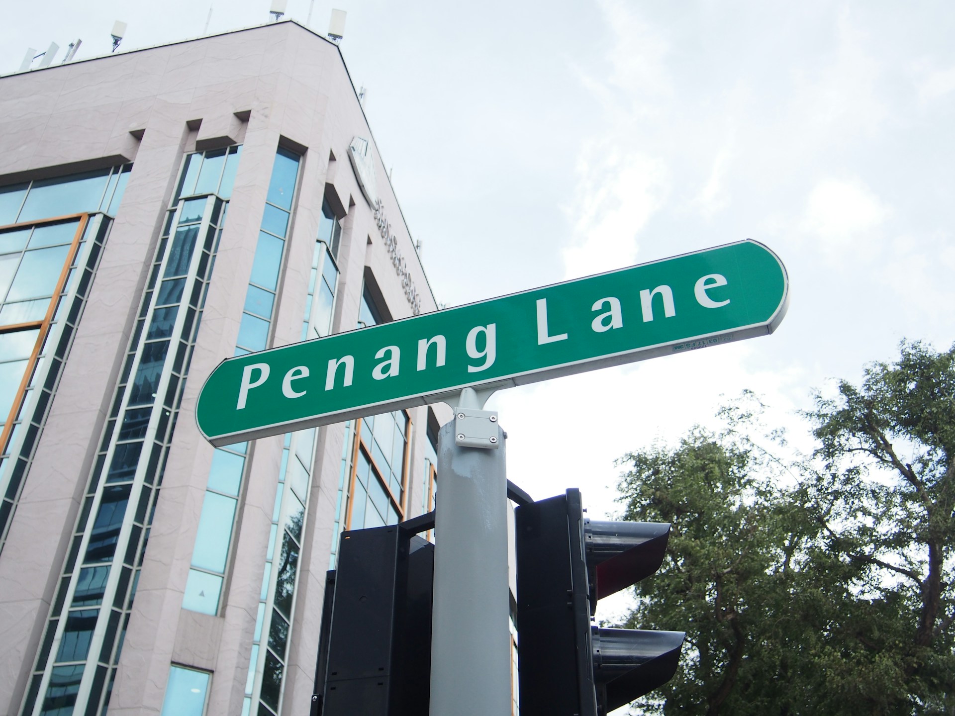 a close up of a street sign with a building in the background