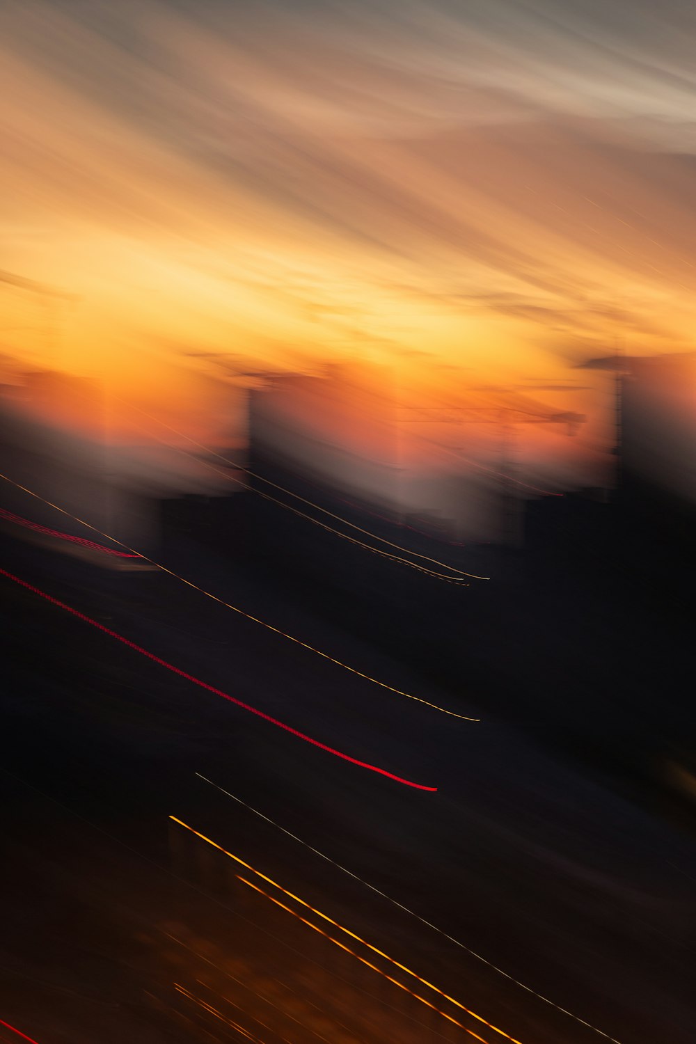 a blurry photo of a city at sunset