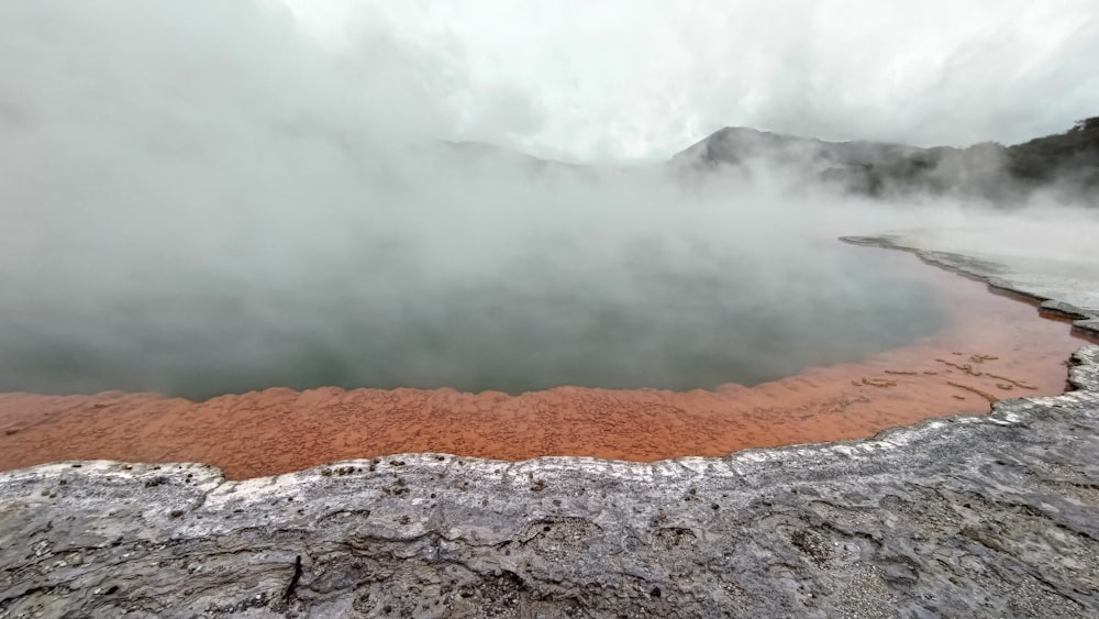a hot spring in the middle of a mountain