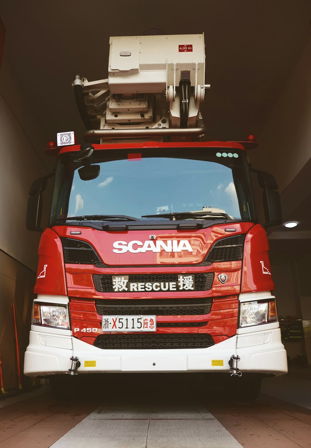 a large red truck parked in a garage