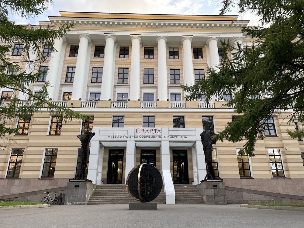 a large building with a statue in front of it