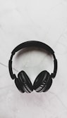 a pair of headphones sitting on top of a white counter