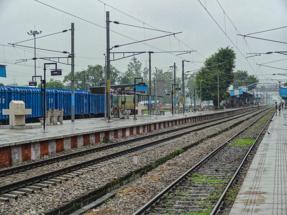 a train station with a train on the tracks