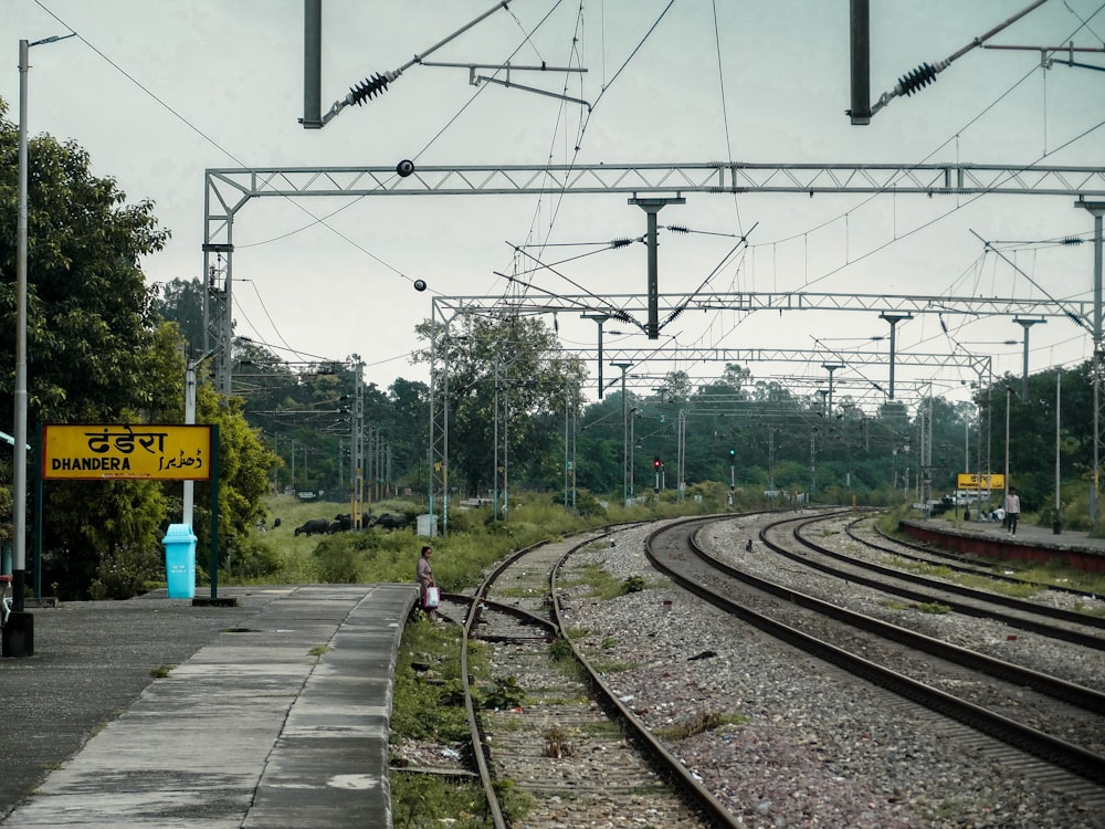 a train track with a yellow sign on it