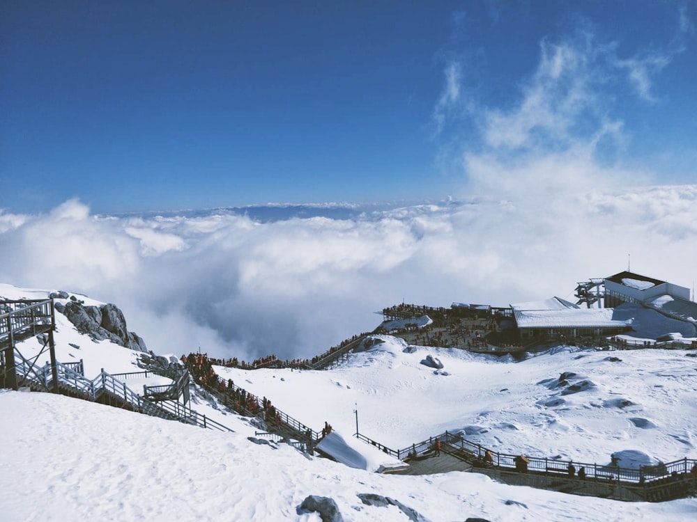 a snow covered mountain with a ski lift on top of it