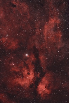 A vibrant screenshot of the galaxyquest space game showing a spaceship navigating through colorful nebulae.