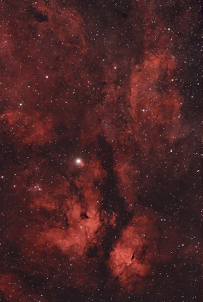 An intense space combat scene with laser blasts illuminating the dark void.