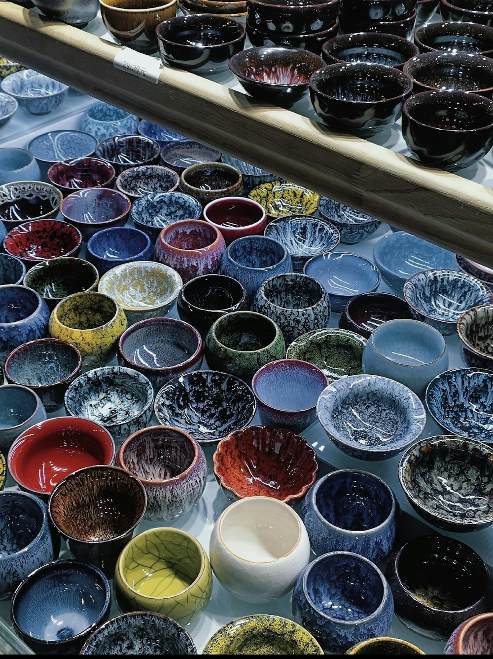 a table topped with lots of different colored bowls