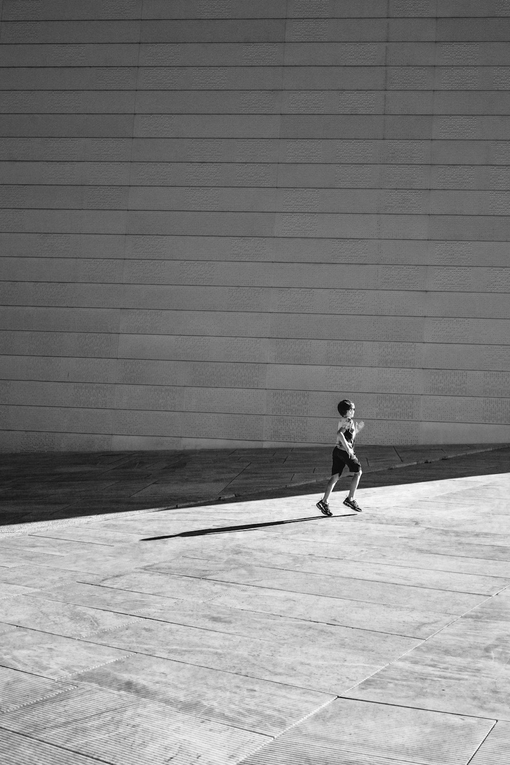 a little boy that is standing in the street