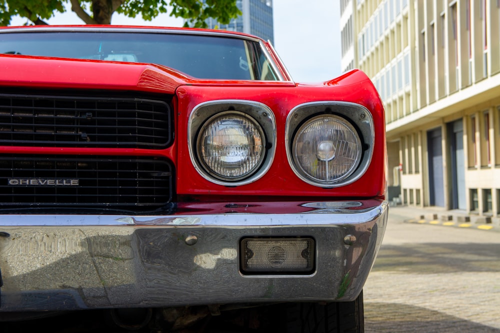 a close up of the front of a red car