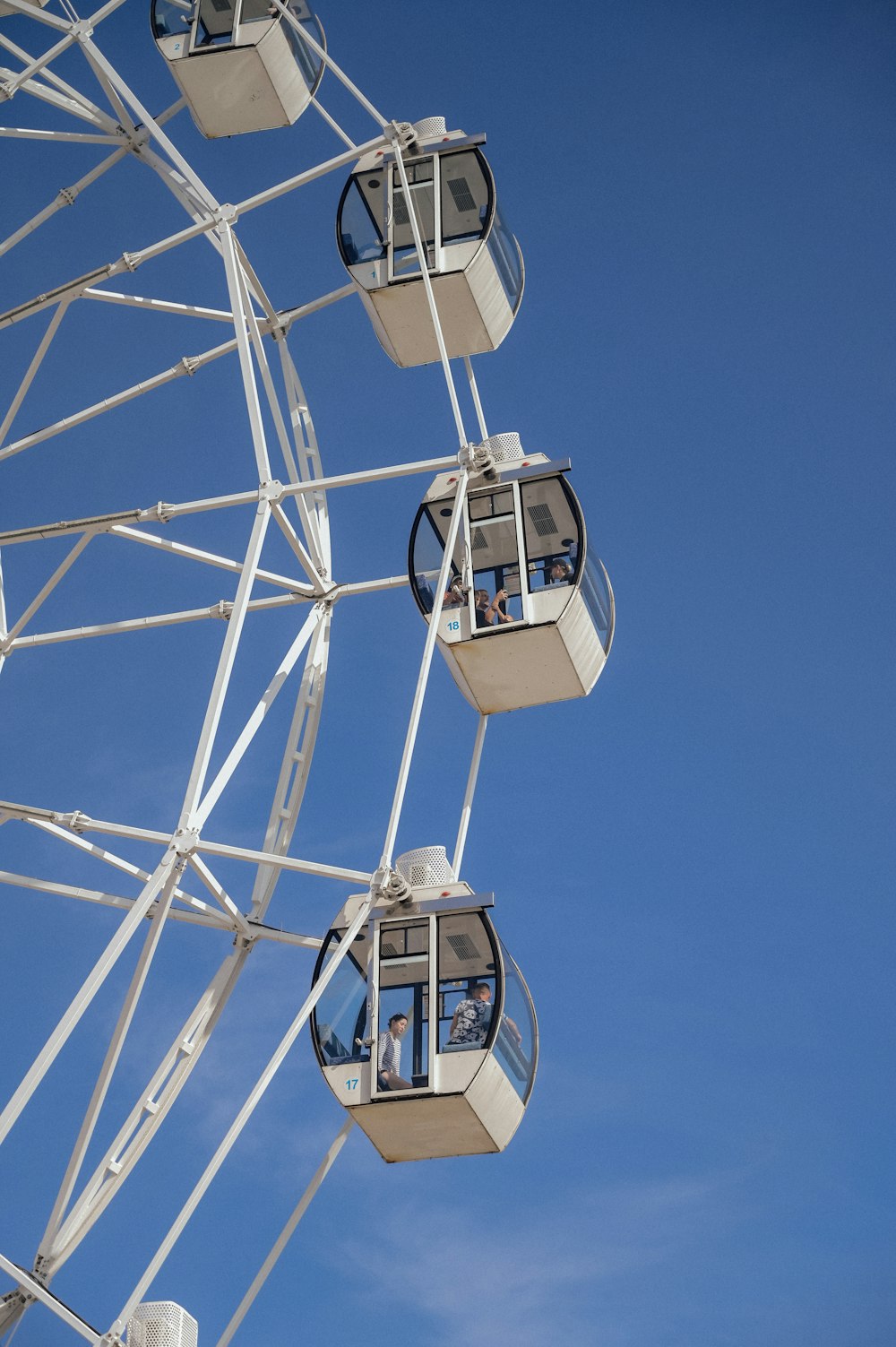 a ferris wheel with people inside of it