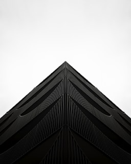 a black and white photo of the top of a building