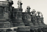 Artisans carefully restoring ancient carvings on Bimbia’s heritage walls.