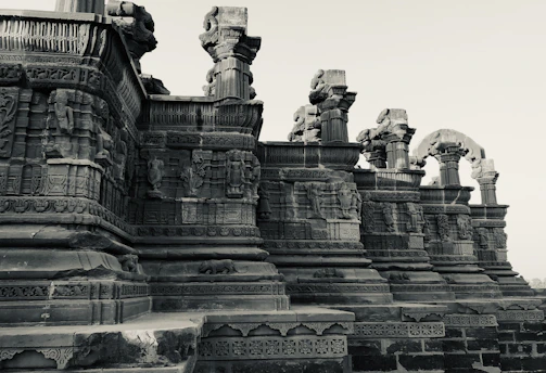 Artisans carefully restoring ancient carvings on Bimbia’s heritage walls.