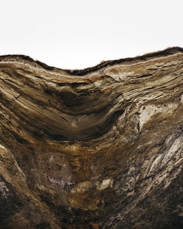 A scenic view of a geological site with students studying rock formations.
