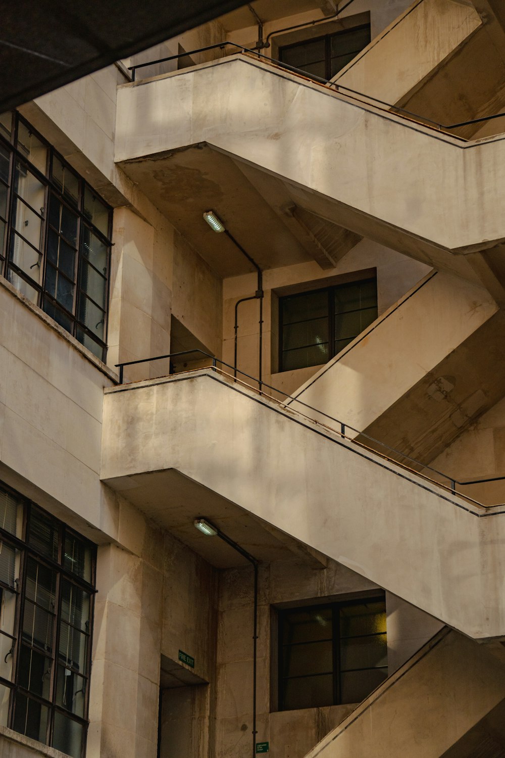 a building with a bunch of balconies next to it