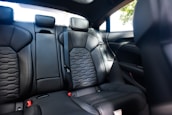 A comfortable car interior with a passenger enjoying a smooth ride.