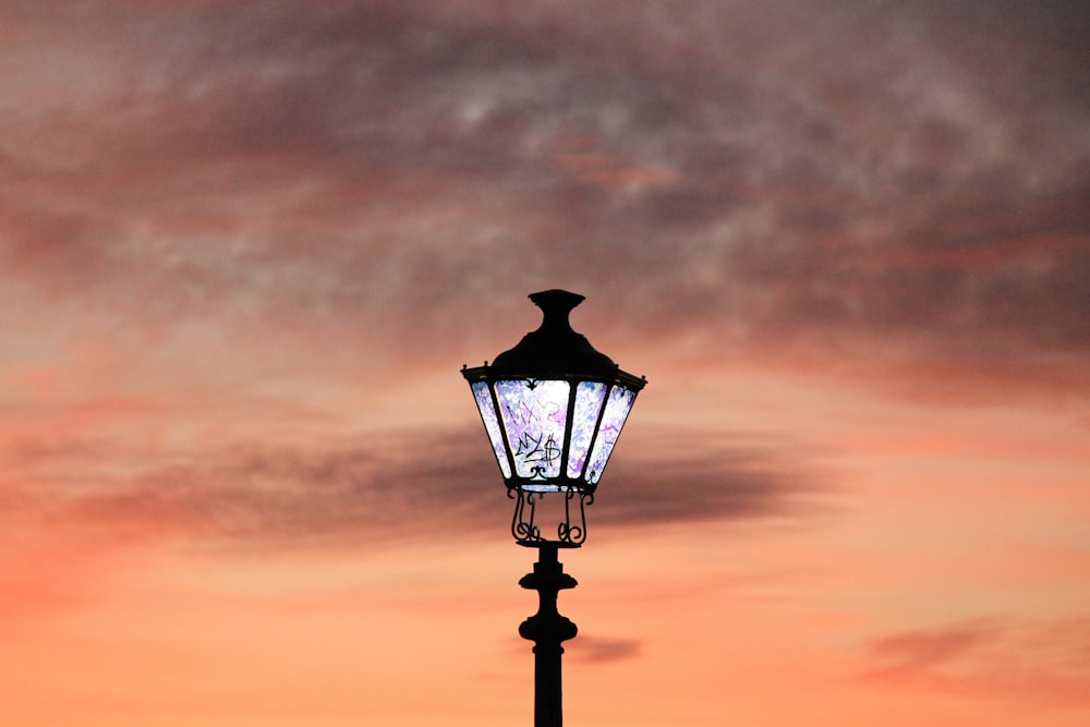 a street light with a sky in the background