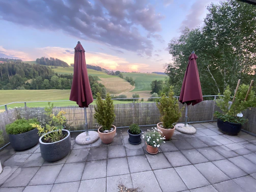 Elegant terrace with panoramic views of the Umbrian countryside at golden hour.