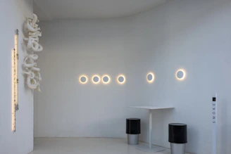 Custom 3D printed recessed smoke detector base in a minimalist interior.