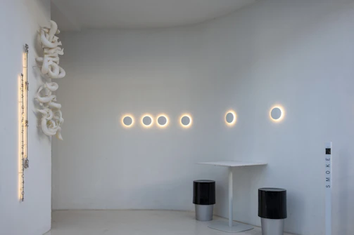 Custom 3D printed recessed smoke detector base in a minimalist interior.